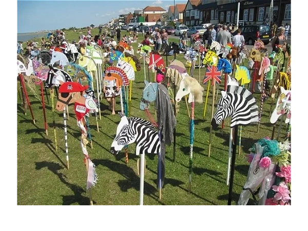 Hobby Horse or Stick horses gathering for an Event at the seaside.