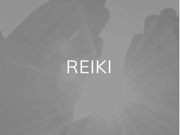 Hands gently surrounding light with the word REIKI at the center.