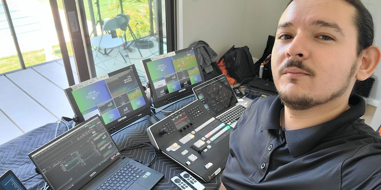 Video Engineer selfie inside control room with ATEM switcher for Apple & MLB private event.