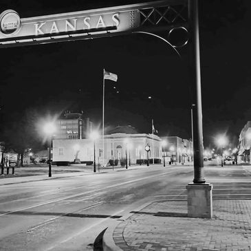 Black and white photo of downtown Parsons, KS Main Street at night.