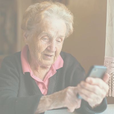 Older woman talking to her phone buddy