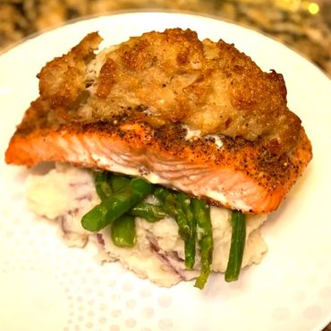 crab stuffed salmon over garlic roasted red potatoes and asparagus