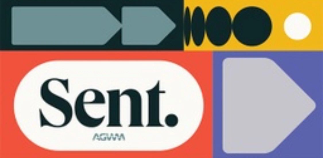 Stack of books next to pencils in a holder and a camera.