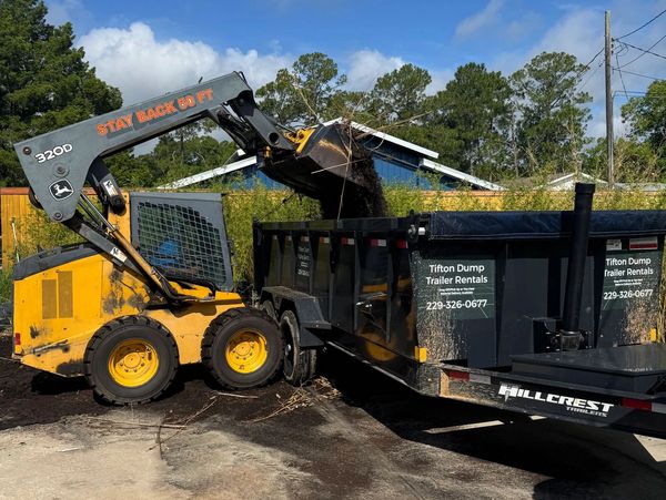Tifton Dump Trailer Rentals providing dirt delivery and site work for a local construction project.