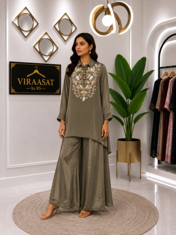 Woman in olive green embroidered kurta and palazzo pants.
