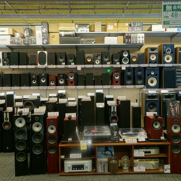 A store display of various speakers and audio equipment in Japan.