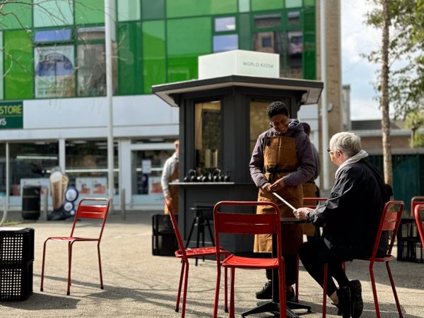 A hexagon shaped bespoke kiosk, pop up activation, designed to be easily moved