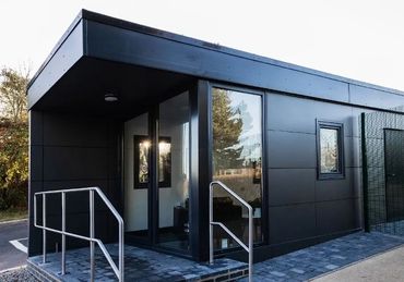 A modular bespoke gatehouse for a warehouse with a welcoming office space on arrival