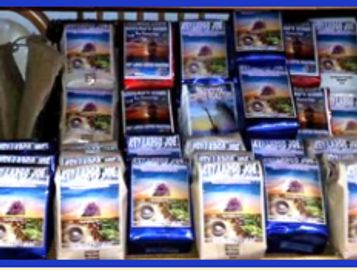 Various coffee packages arranged on a surface.