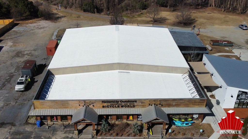 Bicycle World metal roof restoration and coatings in Florence South Carolina post job inspection.