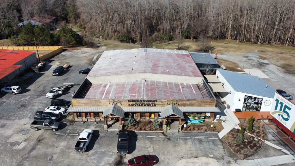 Bicycle World metal roof restoration in Florence South Carolina before roof prep.