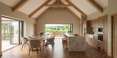 Modern open kitchen and dining area with outdoor view.