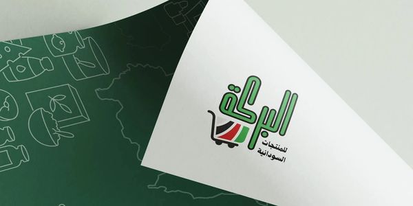 Logo on paper showing Sudanese products with a shopping cart and flag colors.