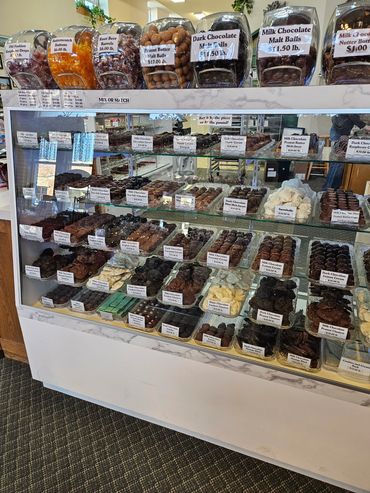 one of our candy displays with various chocolates and malt balls priced by pound.