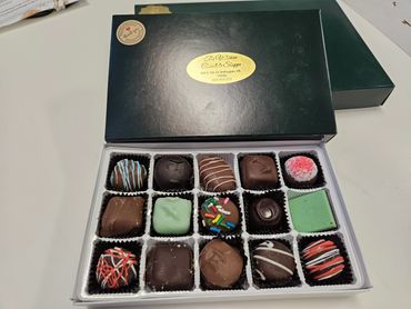 An open box of assorted chocolates from Wisconsin Chocolate Shoppe.