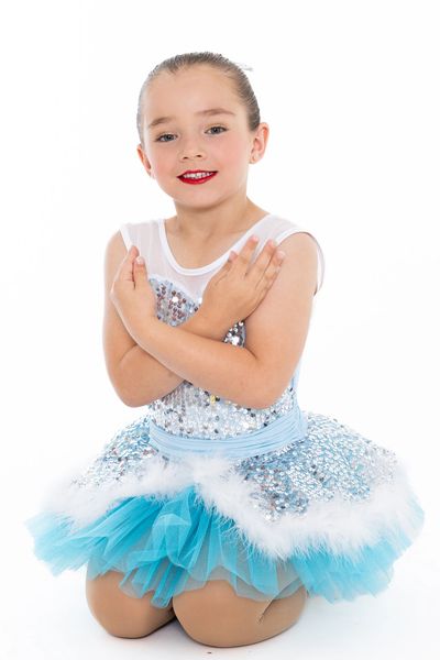 Young girl in a sparkly blue ballet costume.