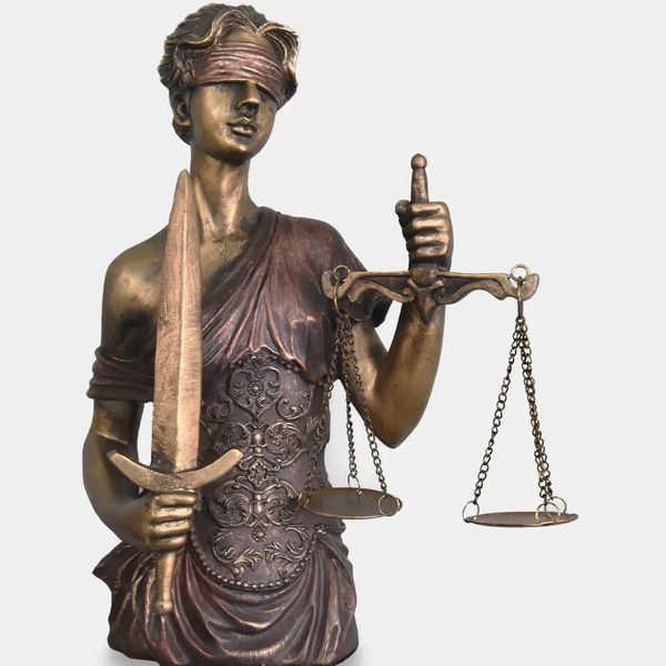 Bronze statue of Lady Justice holding a sword and scales, blindfolded.