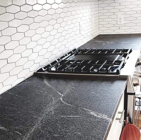 Kitchen renovation in Bismarck North Dakota with honed granite countertops and hex backsplash tile