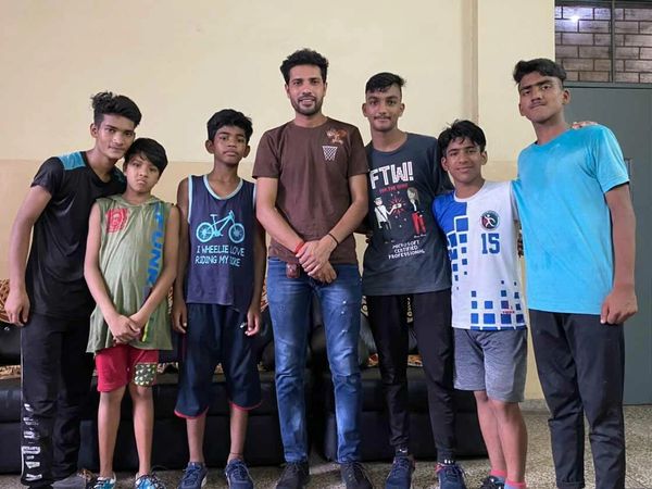 Student athletes at Don Bosco Ashalayam with coach Ishwar Bhati