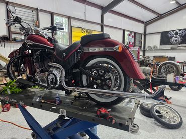 Vintage Harley-Davidson motorcycle in a workshop.
