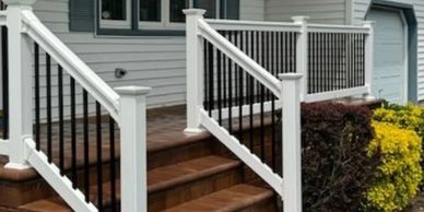 Vinyl handrail with aluminum balusters.