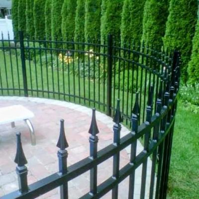 Radiused aluminum sections following pavers.