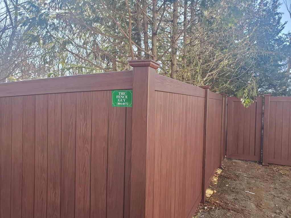 Grand Illusions wood grain PVC fence