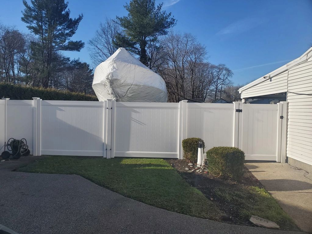 Large opening PVC fence drive gates.