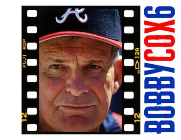 Portrait of a man in a baseball cap labeled 'A'.