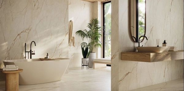 Modern bathroom with marble walls, a freestanding tub, and wooden accents.
