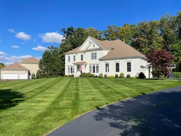Lawn after maintenance service and the grass cut.