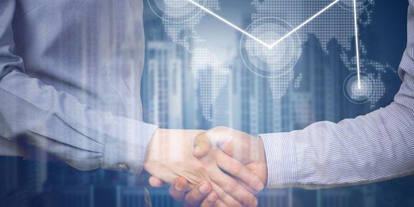 Businessmen shaking hands after business commitment