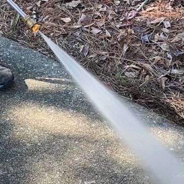 Water jet sprayed on dirty concrete.