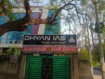 Entrance of Dhyan IAS exam centre with signboard and gate.