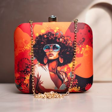 Colorful clutch bag with artistic print of a woman wearing sunglasses and earrings.