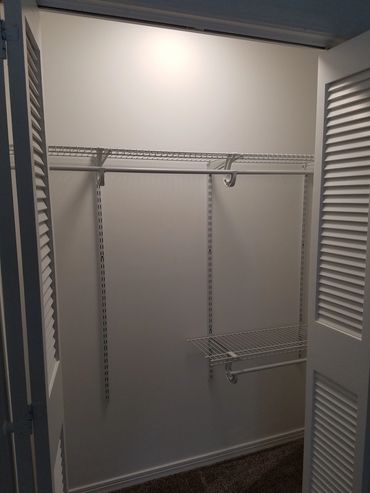 Lighted closet for bedroom one.