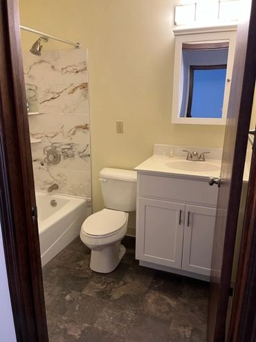 Bathroom with tub and shower.