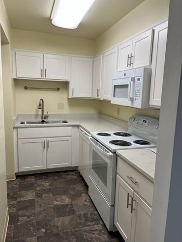 New kitchen with quartz countertops.