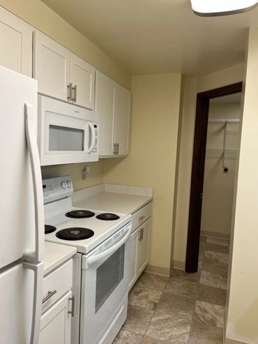 Renovated kitchen with granite counter tops.