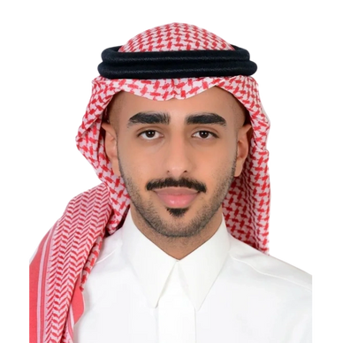Portrait of a man wearing traditional Saudi attire with a red and white checkered headscarf.