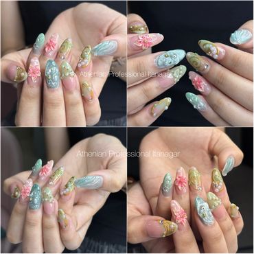 Elegant pastel-themed nail art with floral and pearl accents.