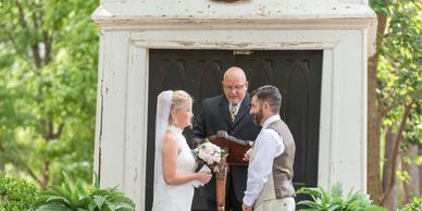 Couple getting married at outside at Forest Hill Park's steeple in Perry, Georgia
