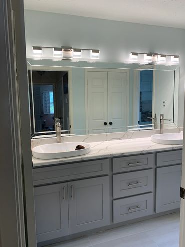 Custom beveled framed mirror by Century Glass.