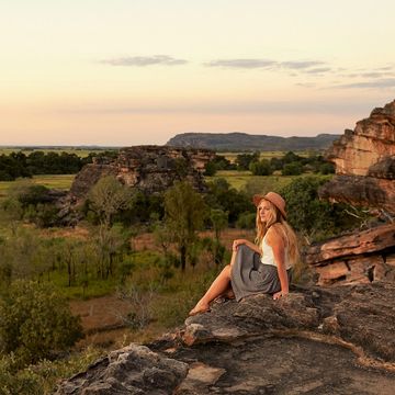 Woman sitting on a rocky outcrop at Kakadu