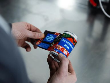 bespoke can with label being applied