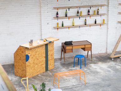 pop-up bar in a warehouse with benches and desk