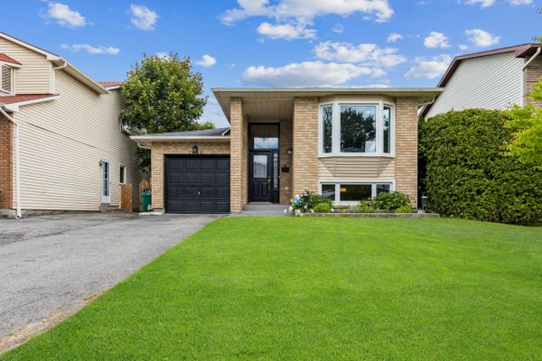 House with green grass and blue sky