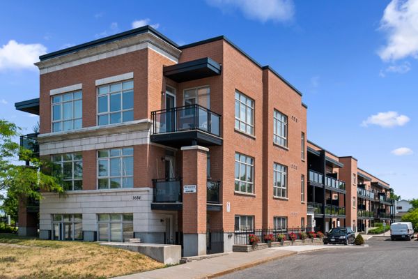 Brick apartment building with blue sky