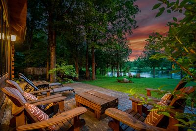 Wood deck and chairs at sunset
