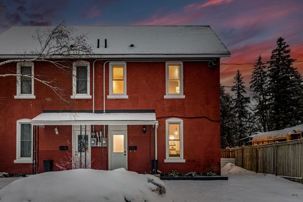 Brick house in the winter at sunset